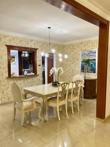 a dining room with a table and chairs at Beautiful Penthouse in La Vega in Concepción de La Vega