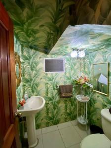 a bathroom with a sink and a wall at Beautiful Penthouse in La Vega in Concepción de La Vega