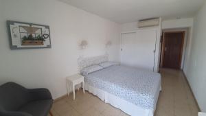 Postel nebo postele na pokoji v ubytování Hostal Roberto