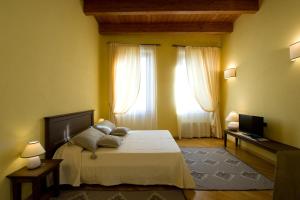 Posteľ alebo postele v izbe v ubytovaní Piazza Azuni 18 Guest House