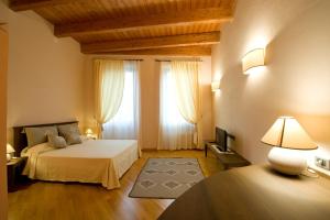 Posteľ alebo postele v izbe v ubytovaní Piazza Azuni 18 Guest House