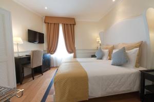 Posteľ alebo postele v izbe v ubytovaní Hotel Bologna ***S