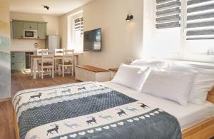 Postel nebo postele na pokoji v ubytování Urtica apartmány