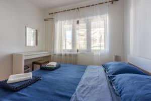 Posteľ alebo postele v izbe v ubytovaní Apartment Tus A2