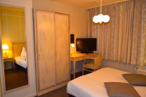 TV a/nebo společenská místnost v ubytování Oranje City Hotel + 23 fotografií