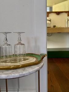 a table with two glass jars on top of it at Ortigia Twin Rooms in Syracuse