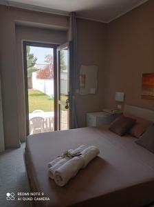 Postel nebo postele na pokoji v ubytování Villa Alfea CAMERE