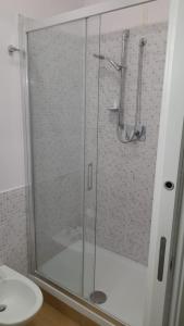 a shower with a glass door in a bathroom at Villa Azzurra Scale of the Turks in Realmonte