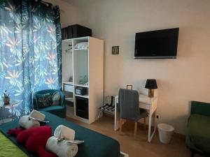 Televízia a/alebo spoločenská miestnosť v ubytovaní AD Trastevere Guest House - by AD Roma