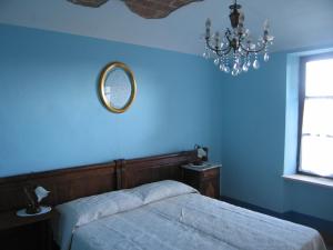 Postel nebo postele na pokoji v ubytování Dalla Magna Livia L&L