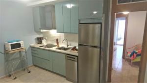 Köök või kööginurk majutusasutuses Cerca playa-AA-Patio privado