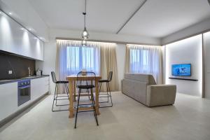 a kitchen and living room with a table and chairs at Five stars Florence luxury apartments in Florence