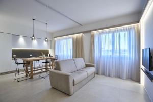 a living room with a couch and a table at Five stars Florence luxury apartments in Florence