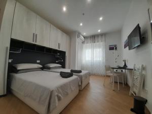 Posteľ alebo postele v izbe v ubytovaní TrustEverVito