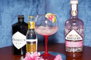 a drink in a glass next to two bottles of alcohol at Hamlet Hotels Maidstone in Maidstone +30 photos
