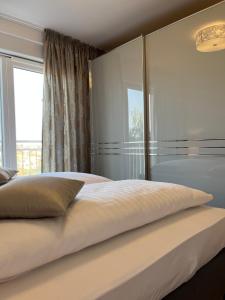 Łóżko lub łóżka w pokoju w obiekcie Apartman Yacht