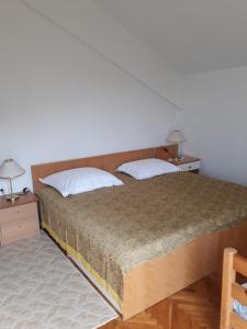 Posteľ alebo postele v izbe v ubytovaní Apartmani Zokić