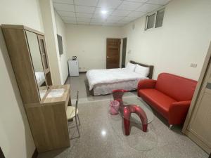 Postel nebo postele na pokoji v ubytování 枋寮遊客民宿