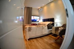 TV a/nebo společenská místnost v ubytování Apartamento Quarto e sala luxo COPACABANA O MUST'