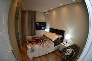 Postel nebo postele na pokoji v ubytování Apartamento Quarto e sala luxo COPACABANA O MUST'