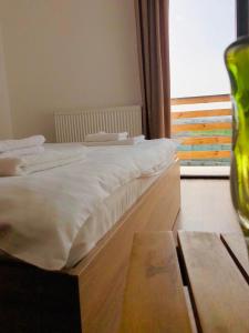 Postel nebo postele na pokoji v ubytování Plai Dobrogean + 12 fotografií