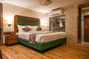 Suvidha Suites客房内的一张或多张床位