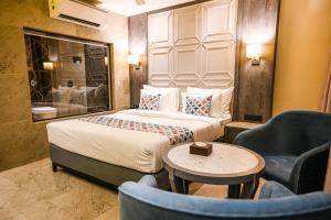 Suvidha Suites客房内的一张或多张床位