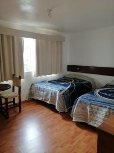 Ένα ή περισσότερα κρεβάτια σε δωμάτιο στο Hotel Sierra Bonita