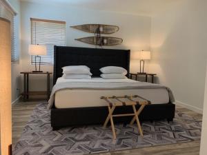 a bedroom with a large bed and two lamps at Rr-edgewater04 in June Lake