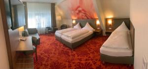 מיטה או מיטות בחדר ב-Hotel Felsenkeller