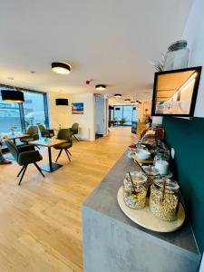 a living room with a table with baskets of food at Creo München Süd in Munich +9 photos