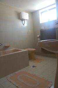 a bathroom with a sink and a bath tub at Szalai Vendégház in Cserszegtomaj