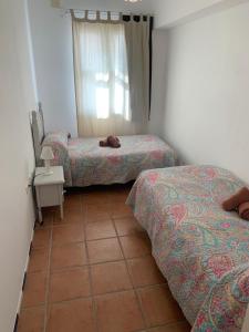 Ένα ή περισσότερα κρεβάτια σε δωμάτιο στο Casa Carmen