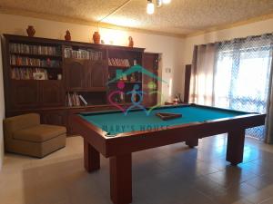 a living room with a pool table in it at Mary's House in Cantanhede