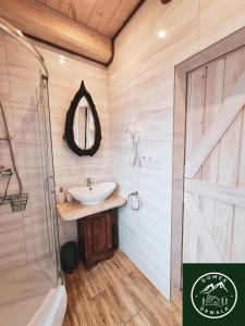 a bathroom with a sink and a shower at Domek Drwala k. Karpacza in Sosnówka +99 photos
