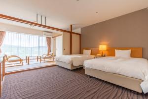 เตียงในห้องที่ Wisterian Life Club Usami