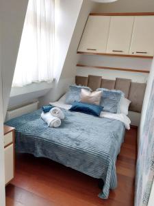 En eller flere senge i et værelse på JM Sopot Apartament Monte
