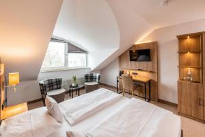 Postel nebo postele na pokoji v ubytování Göbel's Sophien Hotel + 37 fotografií