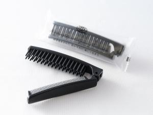 a black comb and a white plastic bag at APA Hotel Roppongi SIX in Tokyo