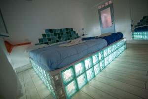 Letto o letti in una camera di Suite House L'Isola Che Non C'è