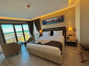 A bed or beds in a room at MQ Hotel