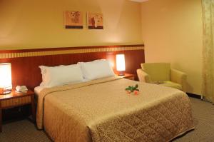 Postel nebo postele na pokoji v ubytování Eastern Beauty Hotel