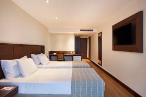 Säng eller sängar i ett rum på Windsor Palace Copacabana