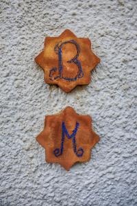 two star cookies with the letter b on them at Blanca Martín in Trevélez