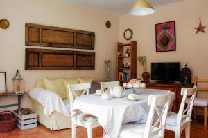 a living room with a table and a couch at Blanca Martín in Trevélez