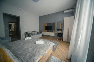 Cama o camas de una habitación en Manoir Apartments City Center