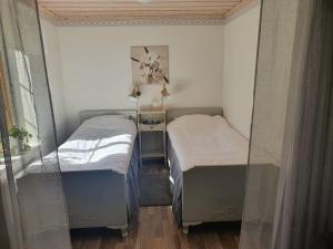 Postel nebo postele na pokoji v ubytování Magasinet