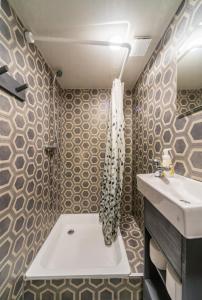 a bathroom with a sink and a toilet in it at Tiny Village Latvia in Bērzciems