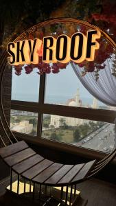 a window with a bench in front of a sky roof at Panorama Portsaid Hotel in Port Said +20 photos