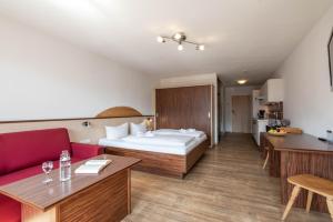Llit o llits en una habitació de Hotel-Gasthof Andreas